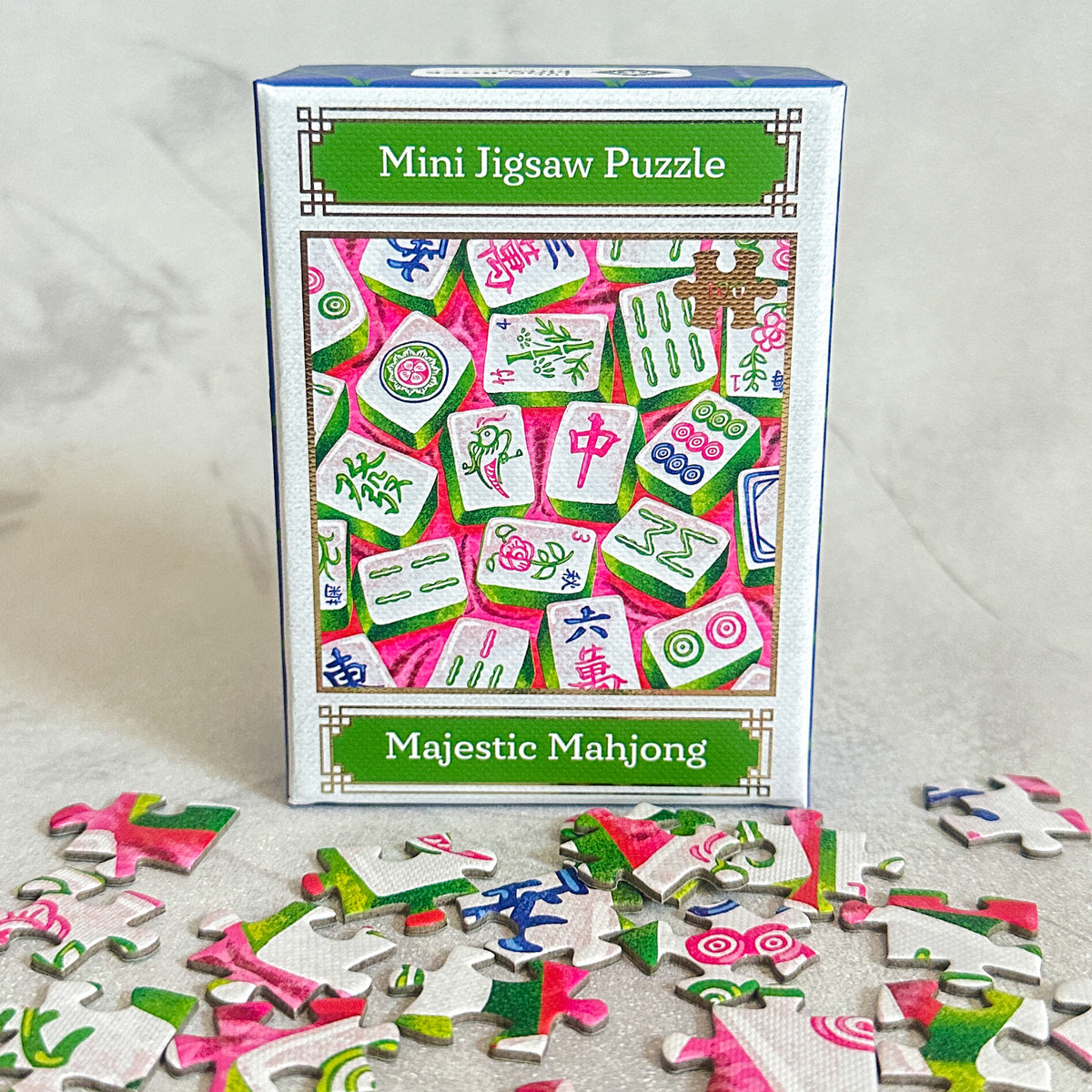 Majestic Mahjong mini jigsaw puzzle set with packaging on a light background